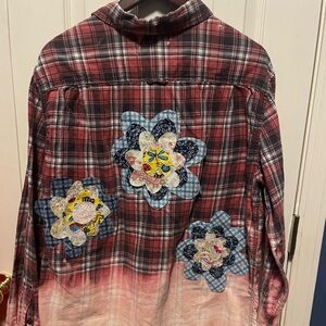 Hand bleached shirt with hand sewn appliqués